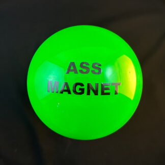 Green Oversized Shift Knob with the words "ass magnet" instead of a real shift pattern