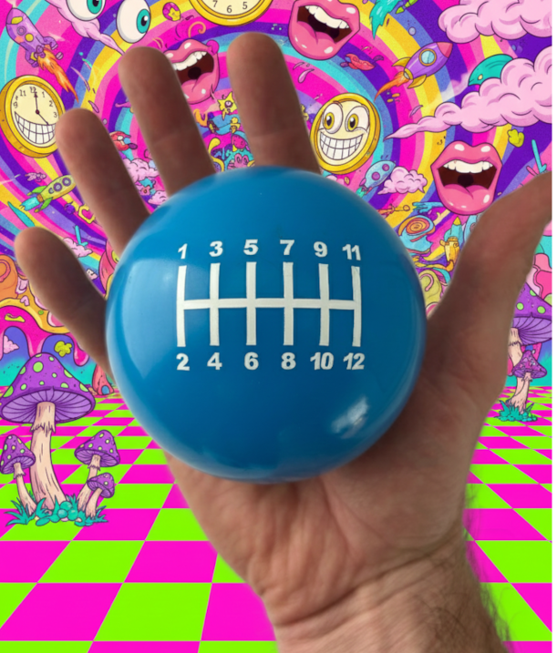 Large blue round shift knob with a 12 speed shift pattern, to poke fun at the opening race scene in the fast and furious. also includes a wacky background that was created with AI